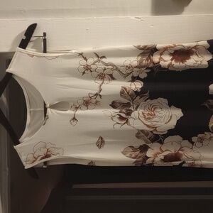 Dress. Long, sleeveless,I think large. Flowers print. Two usable pockets.preowne